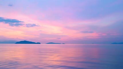 Fototapeta premium Pink and Purple Sunset Over a Calm Sea