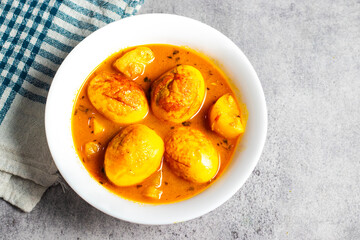 Spiced Egg Curry in Rich Tomato Gravy, Traditional Indian Dish with Boiled Eggs, Aromatic Spices. selective focus. 