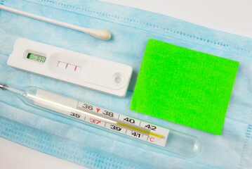 positive covid test and different pills. Coronavirus concept.