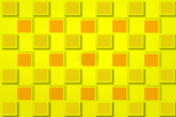 黄色とオレンジ色の四角いブロックが並ぶ黄色い背景のパターン
