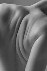 Detailed texture of human skin. Close up shot of young female body. Rear view. Looks beauty and...