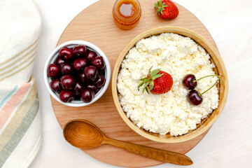 Cottage cheese with summer strawberries cherry.curd cheese in bowl.Healthy dairy Calcium,Protein product,food breakfast,lunch,dieting, detox,proper nutrition