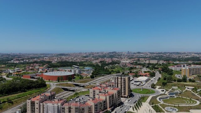 Aerial - Gondomar city center, Portugal, showcasing urban landscape with buildings, roads, and green spaces