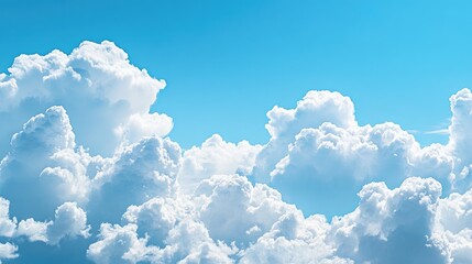 Panoramic view of fluffy clouds drifting across a bright blue sky, evoking a sense of serenity and openness