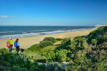 Man and woman hiking Alexandria trail at Addo Elephant National Park in Eastern Cape, South Africa