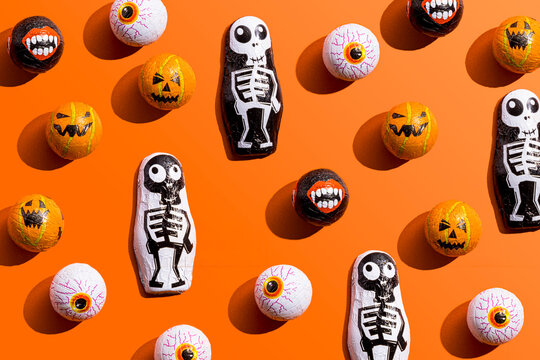 Halloween themed candy against orange background