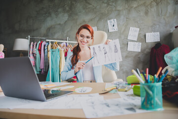 Photo of girl shop assistant have online meeting show client clothes sample in studio office