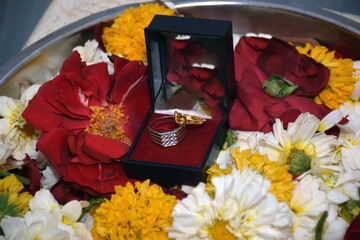 ring ceremony, Beautiful Engagement ring on flower background blur selective focus on subject