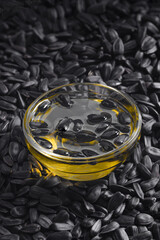 Background of sunflower seeds and oil, close-up of fried seeds. Close up of sunflower seeds as background, top view