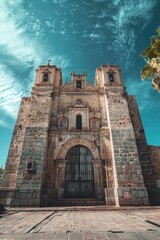 Fototapeta premium A large stone building with a clock tower, suitable for use in historical or architectural contexts