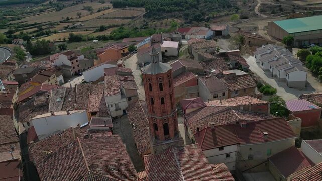 La mata de los olmos, a small village in teruel, spain, with a prominent church tower, aerial view