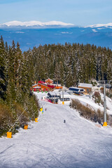 Ski slope in Bansko, Bulgaria and skiers