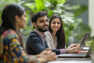 Indian young businesspeople using laptop in group meeting at desk, Generative AI