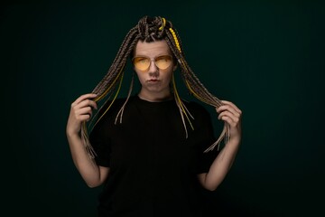 Woman With Dreadlocks Holding Hair in Front of Face