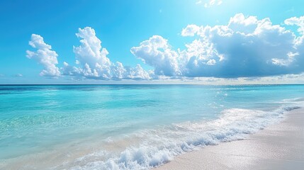 A serene sea view with crystal-clear blue waters and gentle waves under a bright sky.