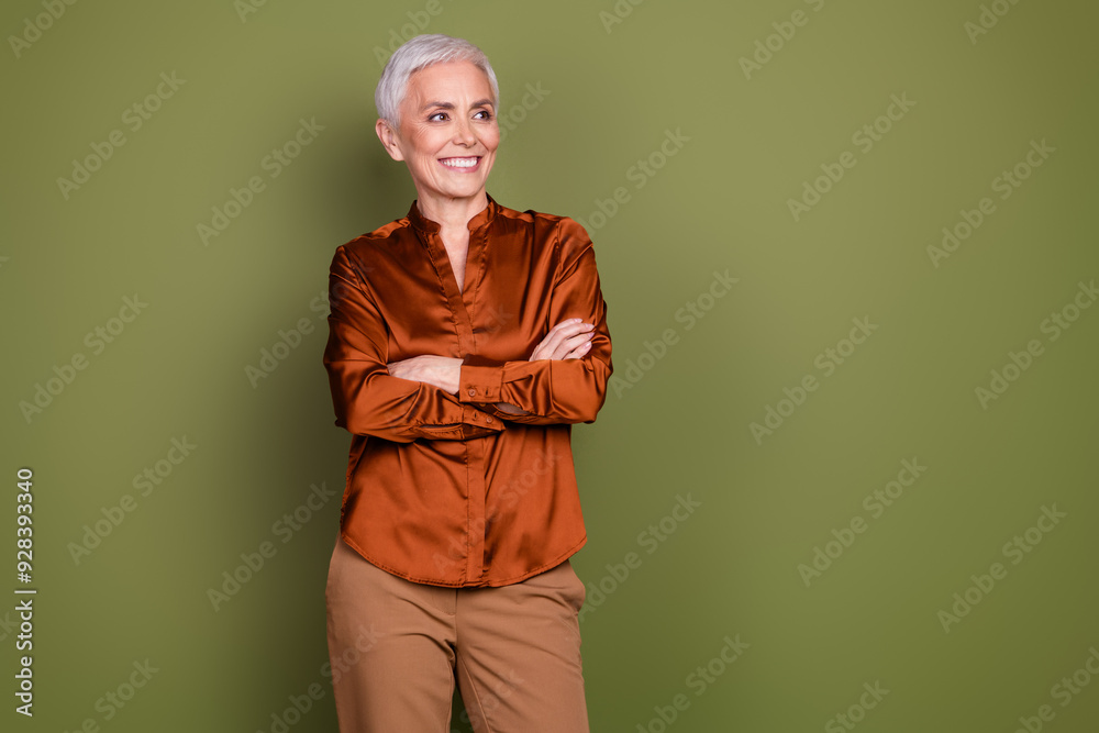 Sticker Photo portrait of pretty retired female crossed hands look empty space wear trendy brown formalwear isolated on khaki color background