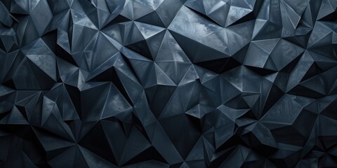 Fototapeta premium A cluster of black origami paper triangles against a dark background