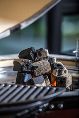 close up of burning charcoal on  Kamado barbecue oven day time