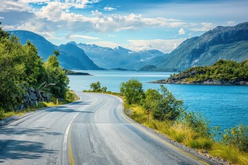 Scenic summer landscape with asphalt road lake mountains and coastline on a sunny day
