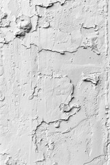 Obraz premium A close-up of a worn-out, cracked wall in black and white