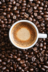 Fototapeta premium Delicious coffee beans and cup