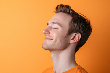 Fototapeta premium A close up of a man's face with his eyes closed