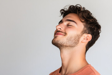 Obraz premium A close up of a man's face with his eyes closed