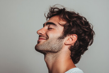 Obraz premium A close up of a man's face with his eyes closed