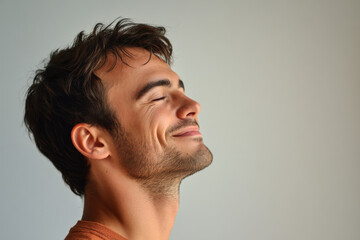 Obraz premium A close up of a man's face with his eyes closed