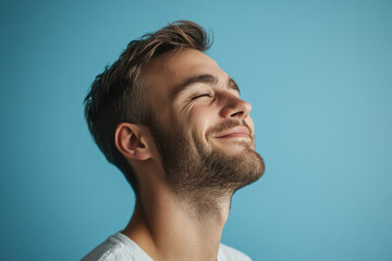 Fototapeta premium A close up of a man's face with his eyes closed