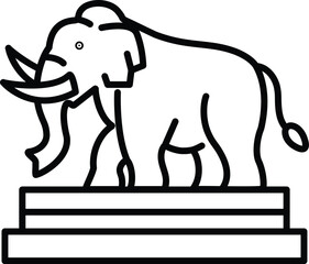 A large elephant is standing on a pedestal
