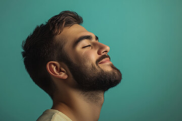Fototapeta premium A close up of a man's face with his eyes closed