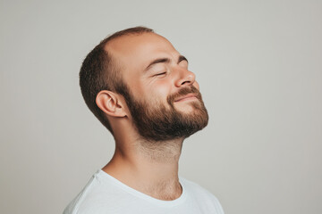 Obraz premium A close up of a man's face with his eyes closed