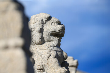 The stone lion on the ancient bridge