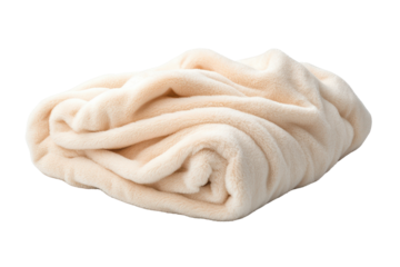 Cozy beige blanket folded perfect for warmth and comfort in any living space or bedroom setting.