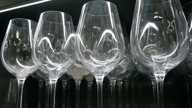 Close-up of many crystal wineglasses on a shelf