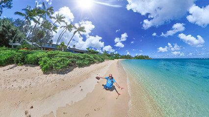 Lonely but happy Man alone at the Hawaiian beach during summer sunshine 