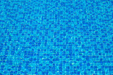 Texture of water in swimming pool for background