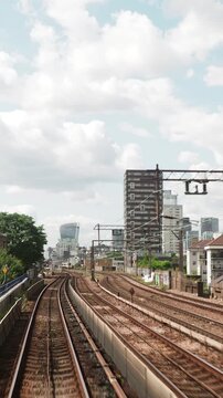 POV shot from the moving docklands light railway london in vertical