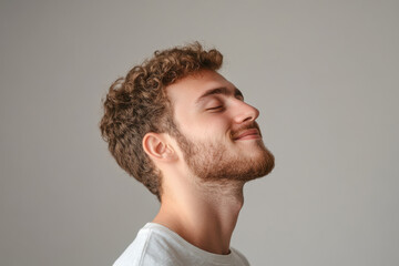 Obraz premium A close up of a man's face with his eyes closed