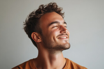 Obraz premium A close up of a man's face with his eyes closed