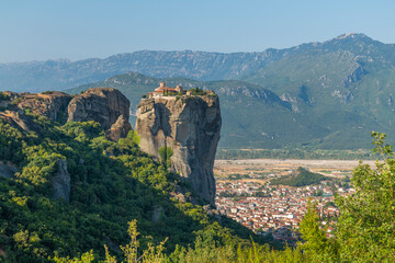 Monasteries located on unique rock formations in the Meteora region of Greece are illuminated by...