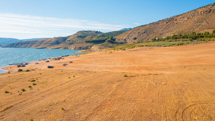 Aerial photo from drone to Iznajar lake and beach Valdearenas.At sunset.Iznajar ,Cordova, Andalusia, Spain