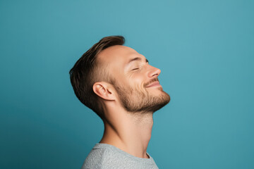 Fototapeta premium A close up of a man's face with his eyes closed