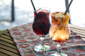 Sangria cocktail in carafe and glass