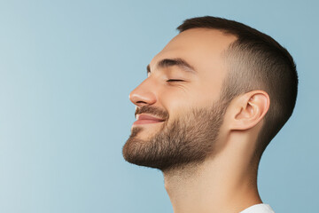 Fototapeta premium A close up of a man's face with his eyes closed