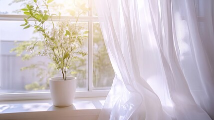 Soft white curtains fluttering in the breeze by an open window, creating a serene and peaceful atmosphere.