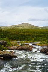 Einunna River by Klemetbrua Bridge from Einunndalen Valley, Norway's longest summer farm valley or 