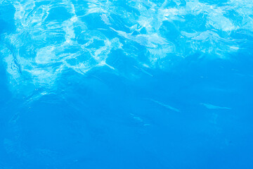 Blue water in the pool in sunny summer day