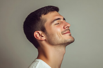 Obraz premium A close up of a man's face with his eyes closed